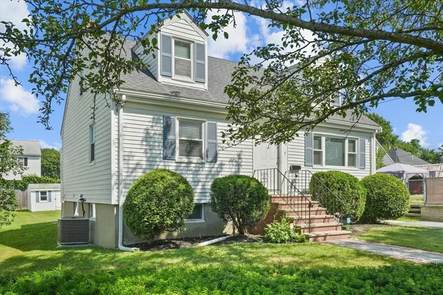 front view of a house with a yard