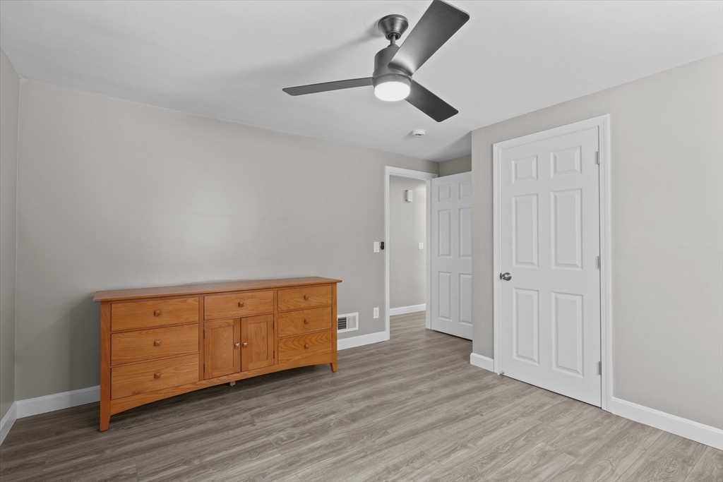 25 Purchase Street Danvers, MA 01923 - Photo 17 of 42 a view of an empty room with wooden floor