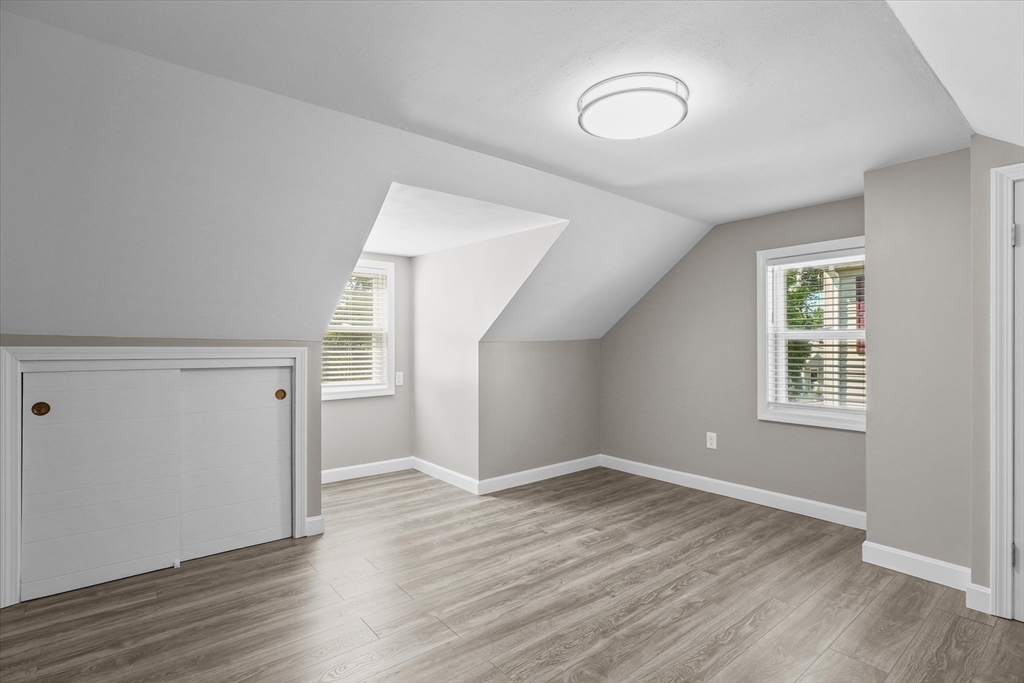 25 Purchase Street Danvers, MA 01923 - Photo 18 of 42 an empty room with wooden floor and windows