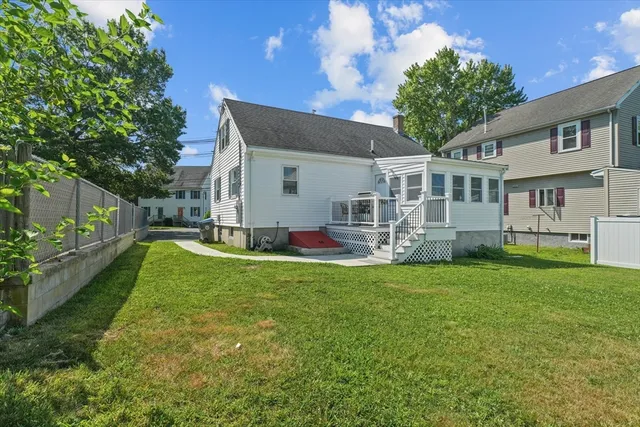 a view of a house with a yard porch and sitting area