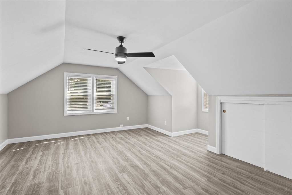 25 Purchase Street Danvers, MA 01923 - Photo 21 of 42 a view of an empty room with wooden floor and a window