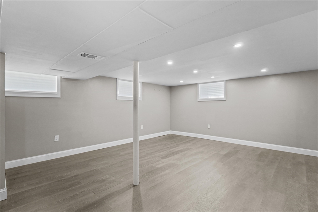 25 Purchase Street Danvers, MA 01923 - Photo 26 of 42 an empty room with wooden floor and windows