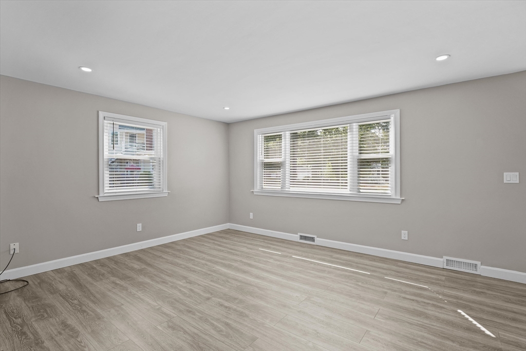25 Purchase Street Danvers, MA 01923 - Photo 4 of 42 a view of an empty room with wooden floor and a window