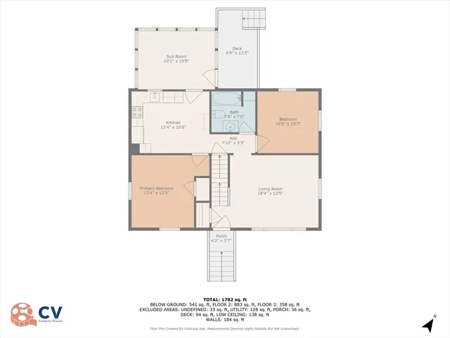 a picture of a room with a table and a potted plant