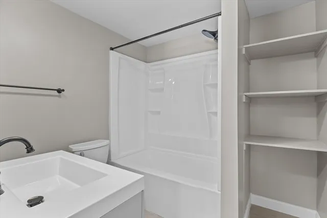 a bathroom with a sink and shower