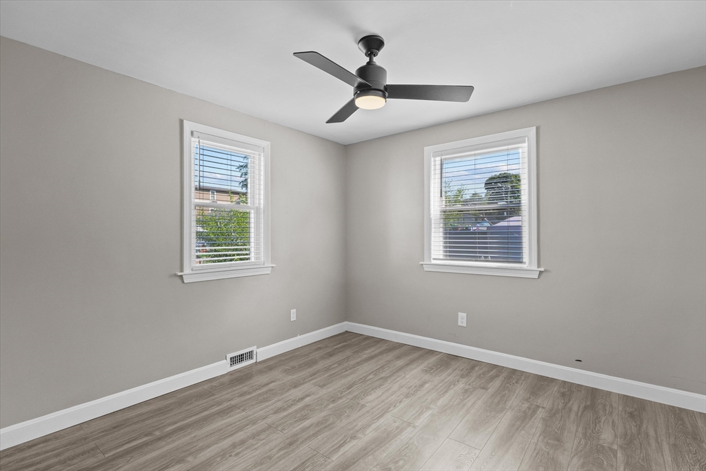 25 Purchase Street Danvers, MA 01923 - Photo 8 of 42 wooden floor in an empty room with a window