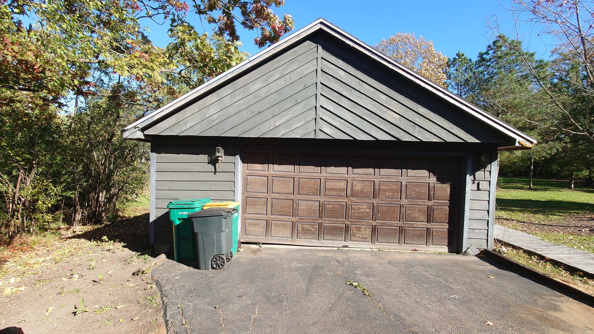 1915 Riverwoods Road Lincolnshire, IL 60069 - Photo 18 of 59 a front view of a house with a yard and garage