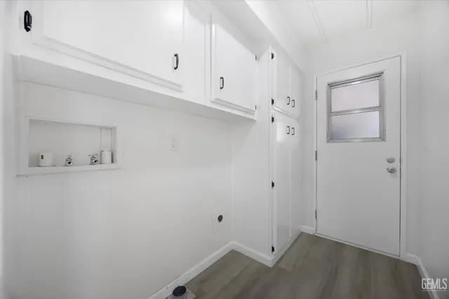 a view of staircase with lots of frames on wall and stairs