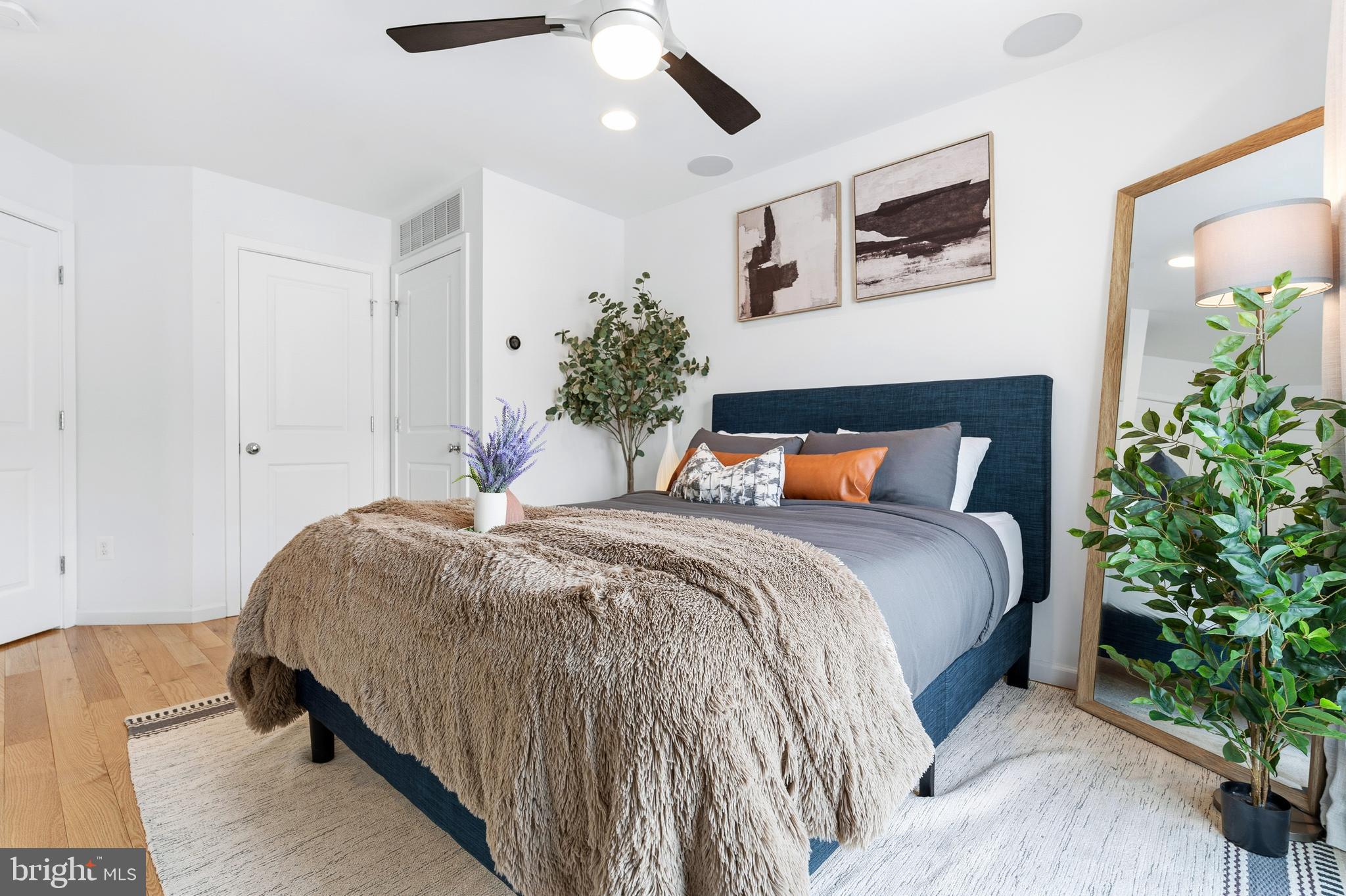 353 L Street Southeast Washington, DC 20003 - Photo 19 of 36 a bedroom with bed and paintings on the wall