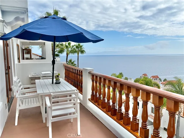 a view of balcony with furniture and wooden deck