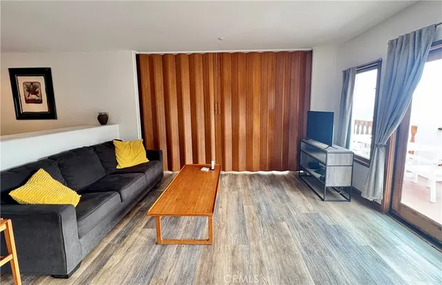a view of a livingroom with table and chairs