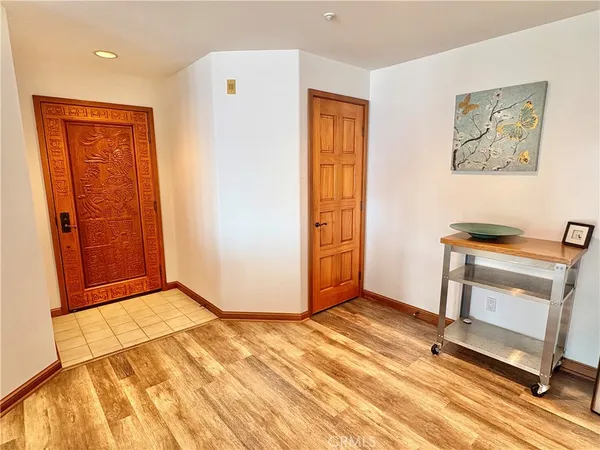 a kitchen with a refrigerator and a stove top oven