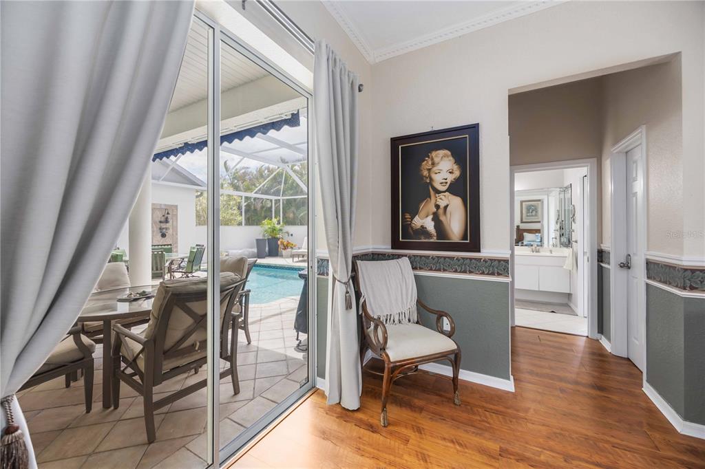 48 Bunker Road Rotonda West, FL 33947 - Photo 28 of 59 a dining room with wooden floor and a window