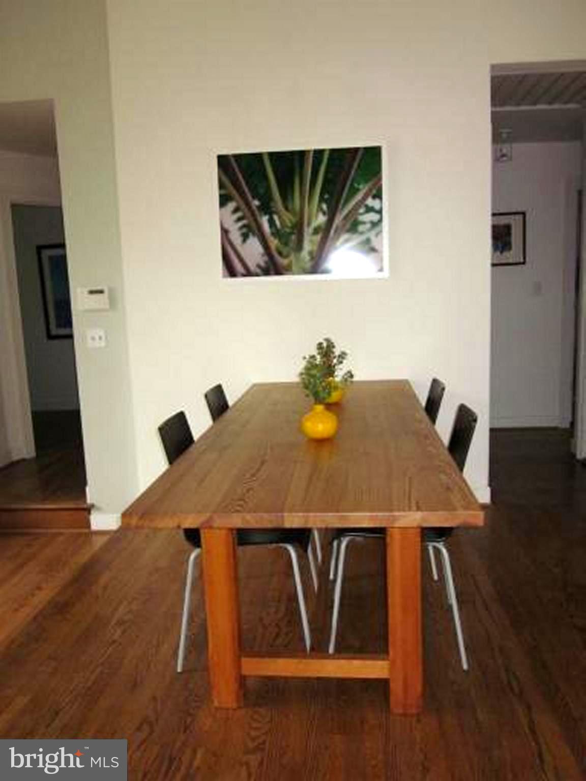 11001 Brent Road Potomac, MD 20854 - Photo 11 of 23 a dining room with wooden floor