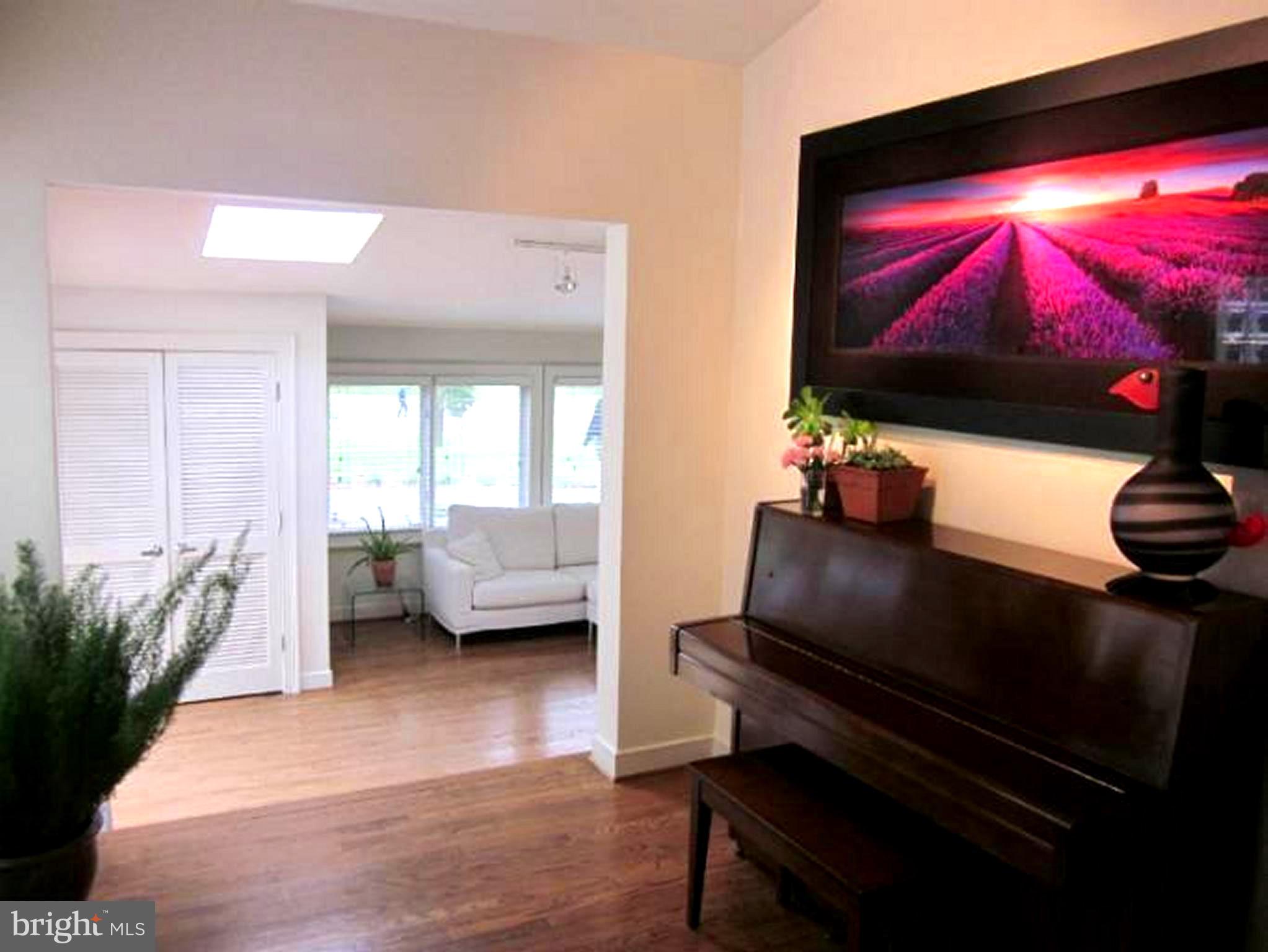 11001 Brent Road Potomac, MD 20854 - Photo 16 of 23 a living room with furniture and a flat screen tv
