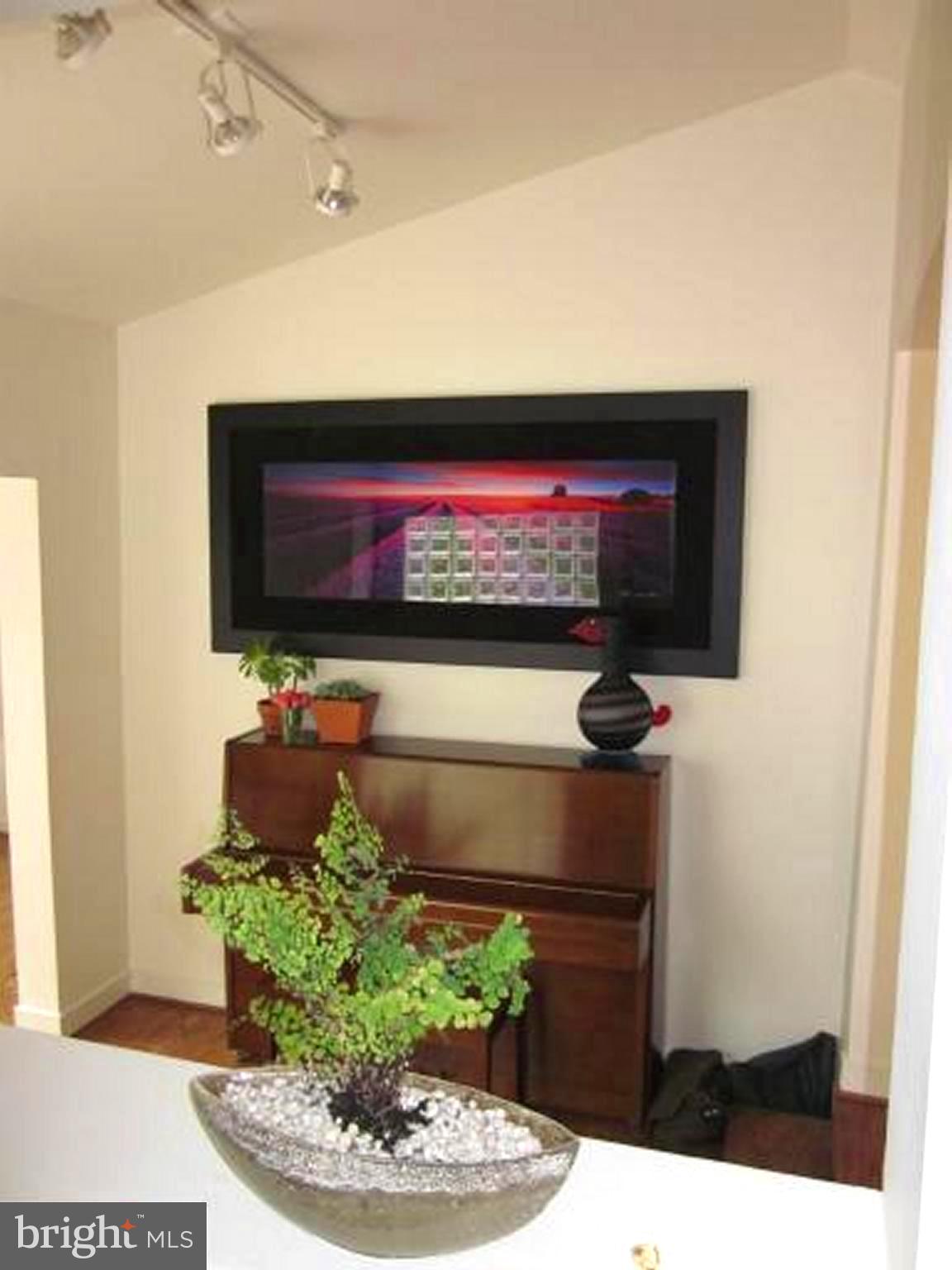11001 Brent Road Potomac, MD 20854 - Photo 17 of 23 a living room with furniture and a flat screen tv