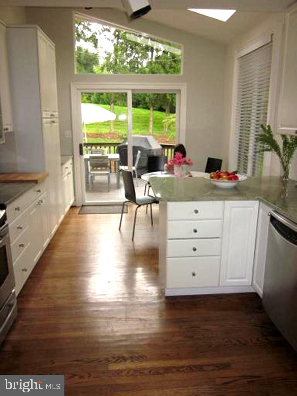 11001 Brent Road Potomac, MD 20854 - Photo 20 of 23 a kitchen with a wooden floor window and chairs