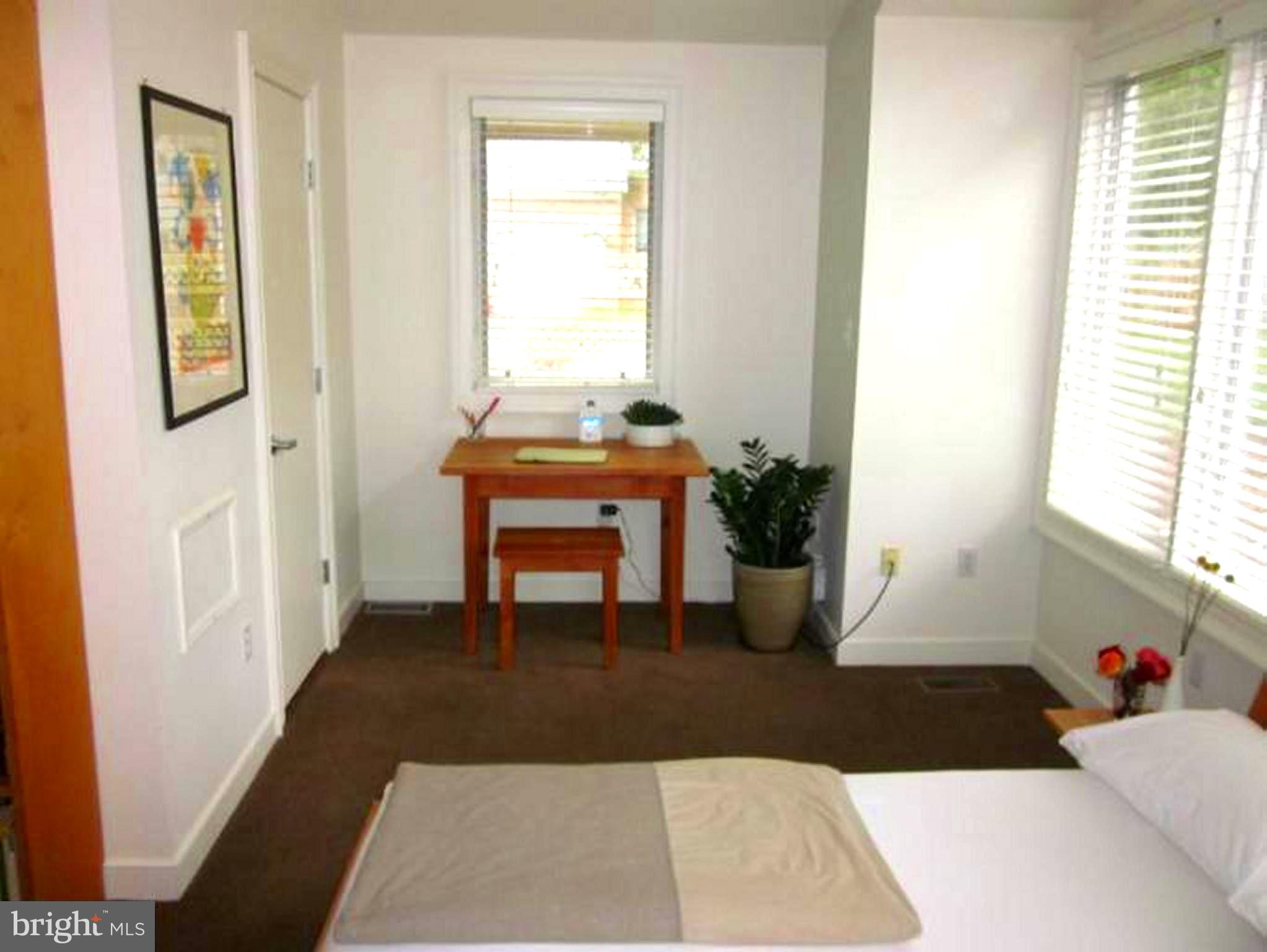 11001 Brent Road Potomac, MD 20854 - Photo 6 of 23 a living room with furniture and a potted plant