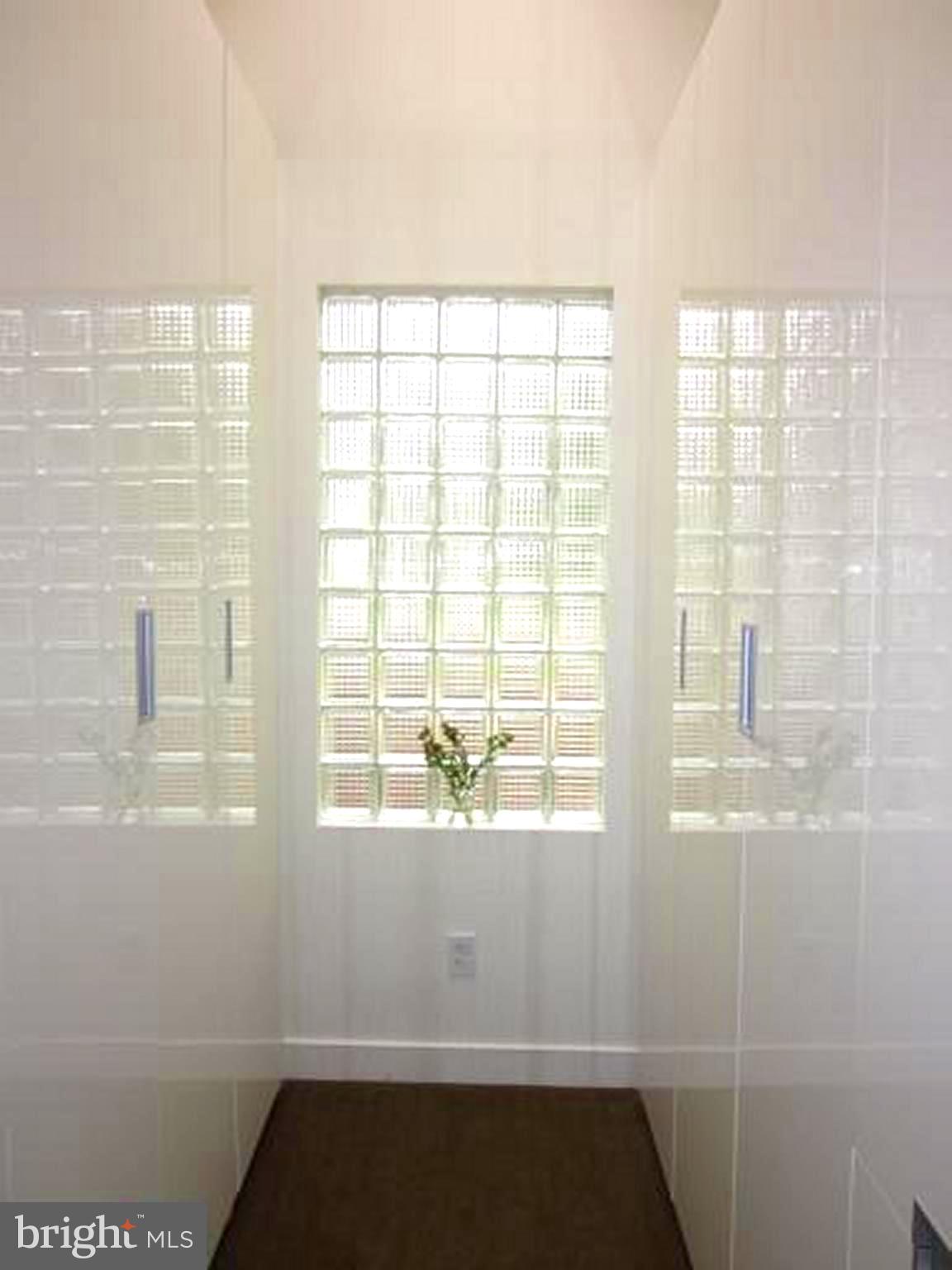 11001 Brent Road Potomac, MD 20854 - Photo 7 of 23 a view of an empty room with a window