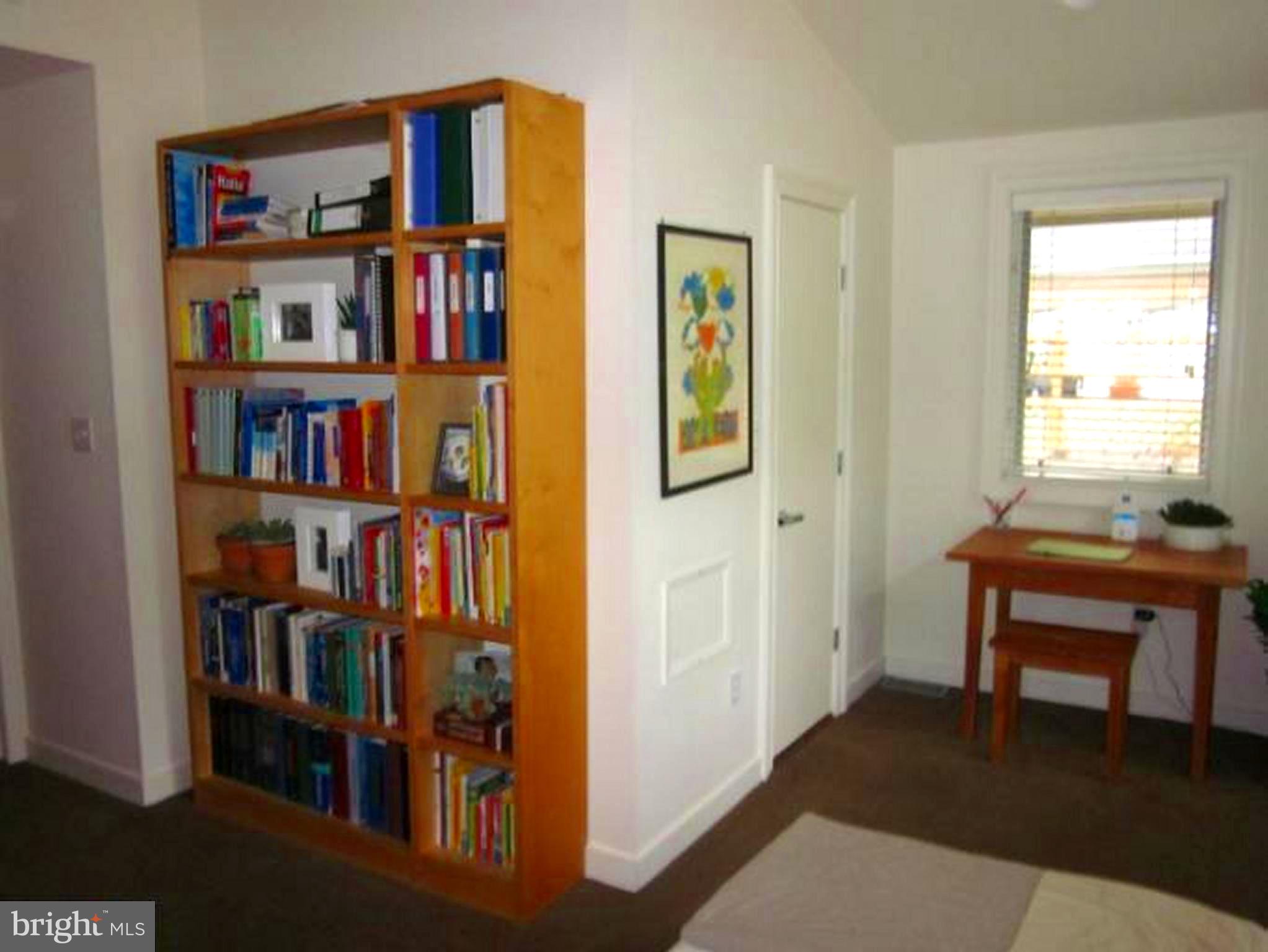 11001 Brent Road Potomac, MD 20854 - Photo 8 of 23 a room that has a table and a bookshelf