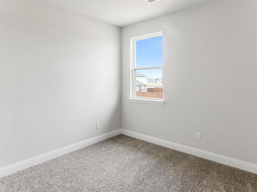 427 Magellan Road Seagoville, TX 75159 - Photo 15 of 25 an empty room with a window