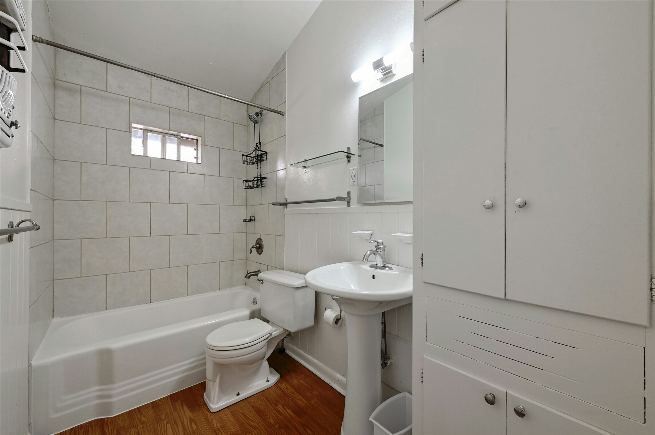 515 Pecan Grove Road, Unit A Austin, TX 78704 - Photo 11 of 17 a bathroom with a toilet sink vanity tub and shower