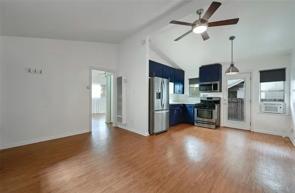 a view of kitchen with stainless steel appliances refrigerator oven and stove