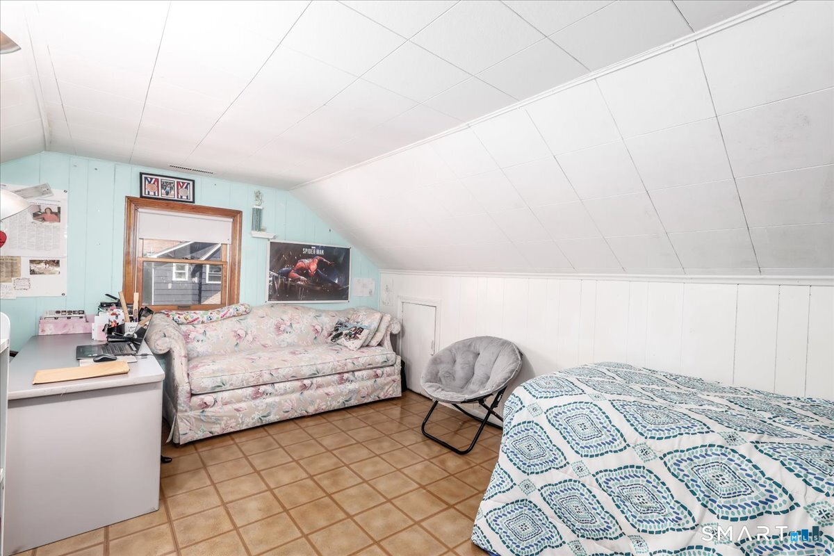 306 Welton Street Hamden, CT 06517 - Photo 27 of 38 a bedroom with a bed and a cabinets
