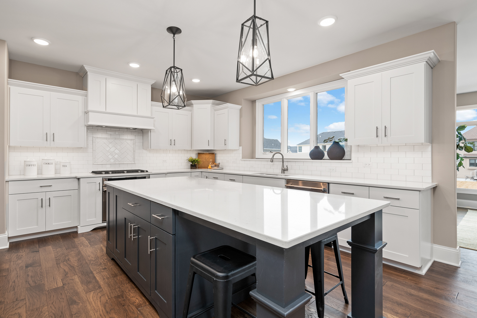 4475 Sassafras Lane Naperville, IL 60564 - Photo 12 of 24 a kitchen with granite countertop a sink a center island and cabinets