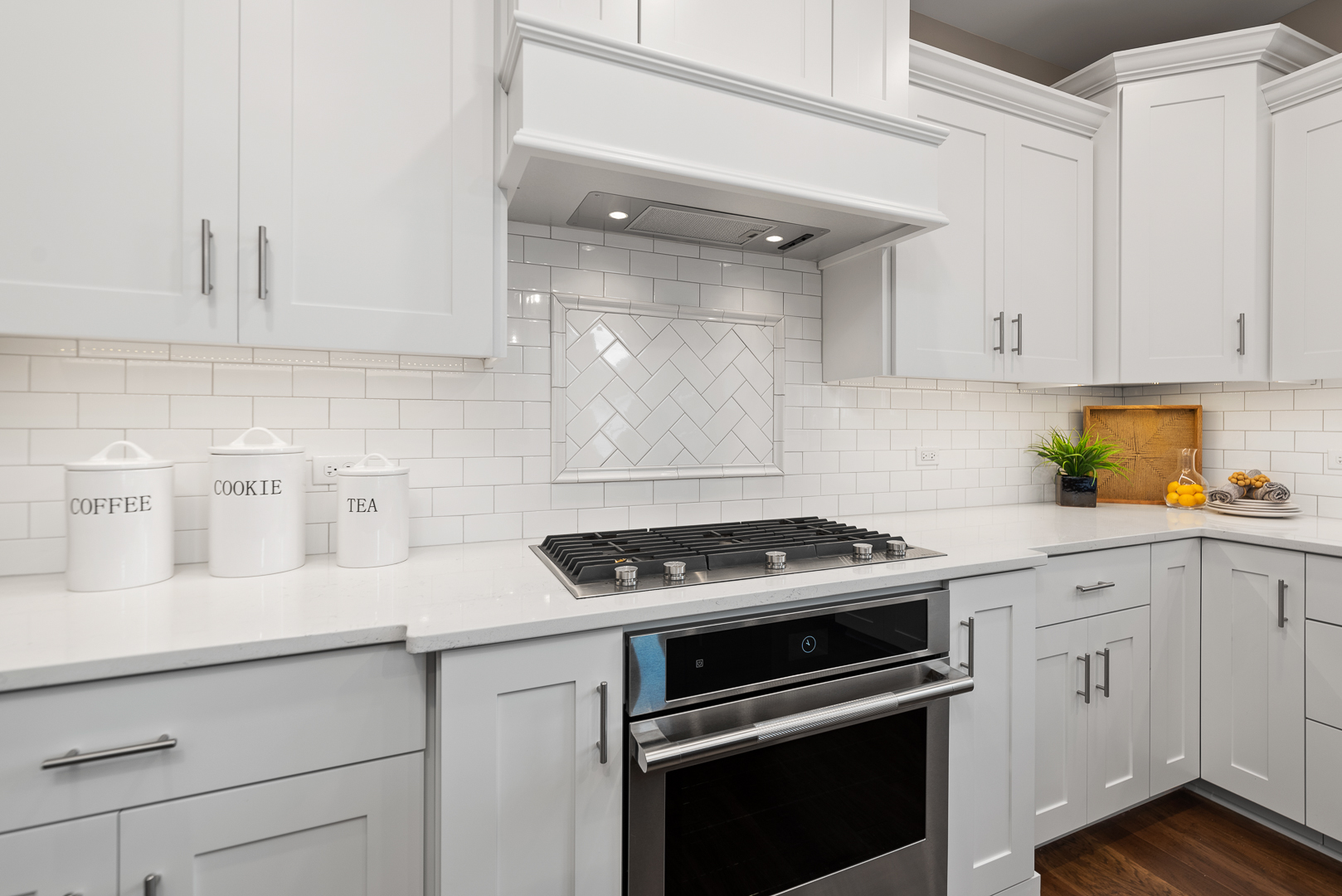 4475 Sassafras Lane Naperville, IL 60564 - Photo 13 of 24 a kitchen with white cabinets and appliances