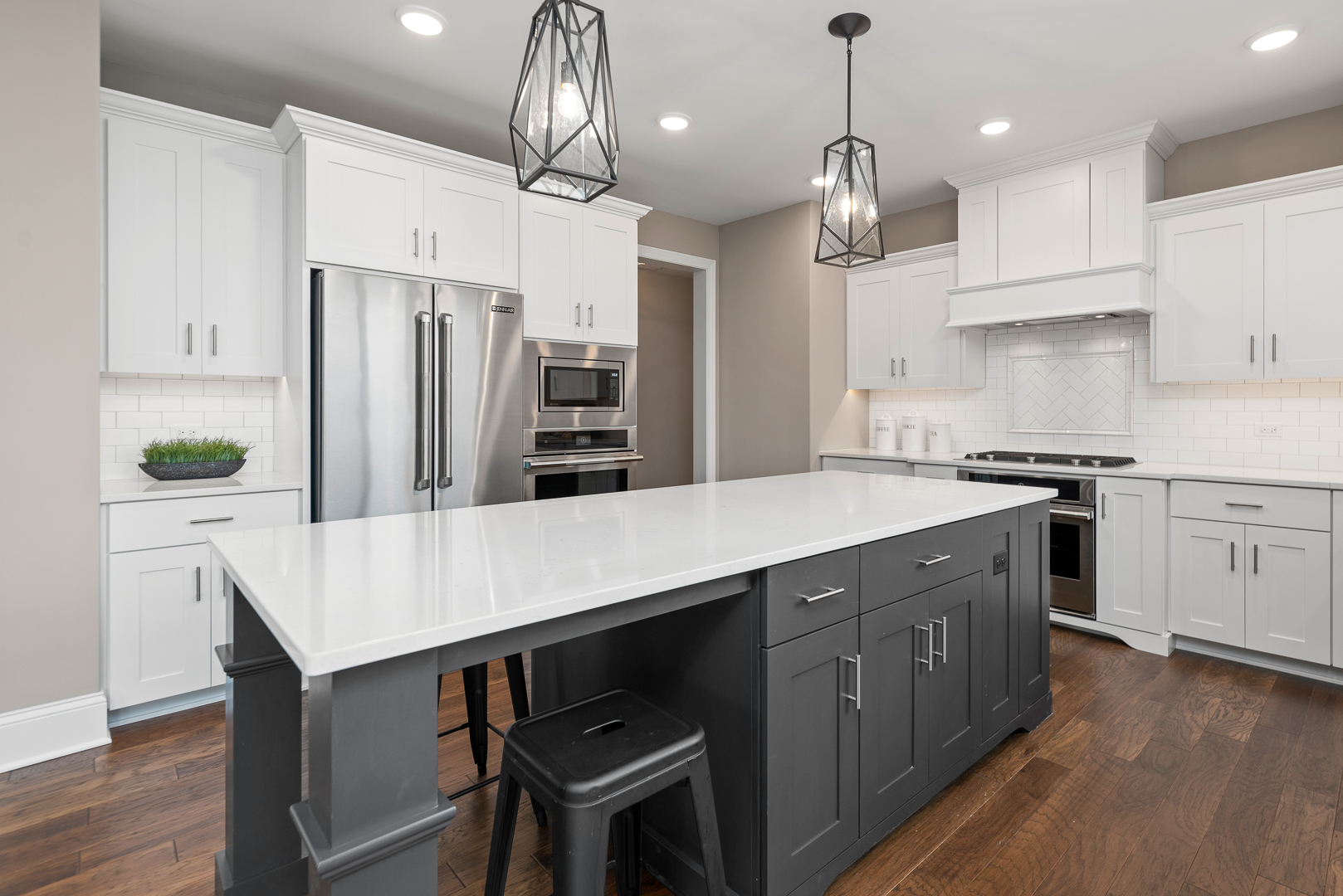 4475 Sassafras Lane Naperville, IL 60564 - Photo 14 of 24 a kitchen with stainless steel appliances a table chairs refrigerator and wooden cabinets