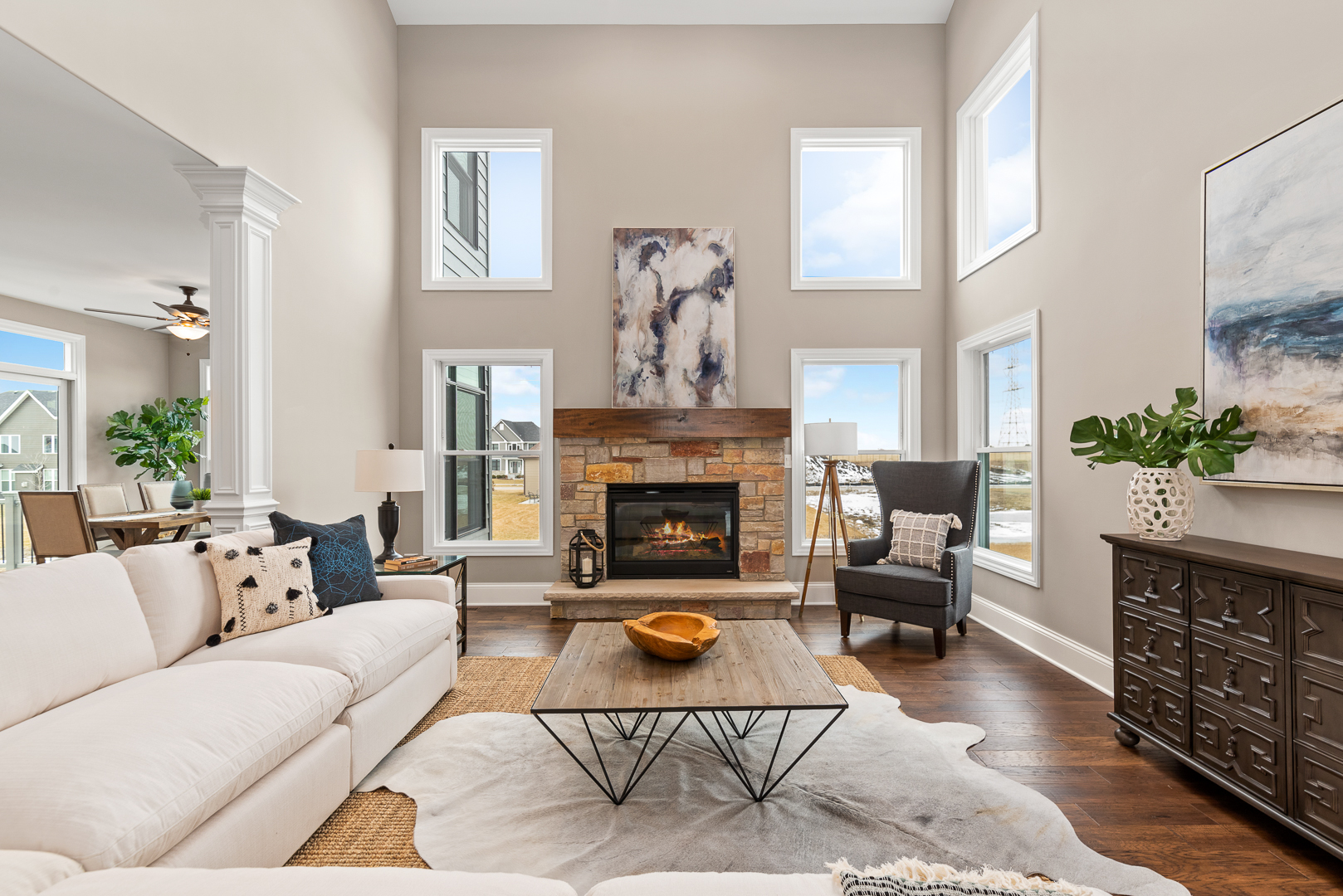 4475 Sassafras Lane Naperville, IL 60564 - Photo 8 of 24 a living room with furniture a fireplace a potted plant and a window