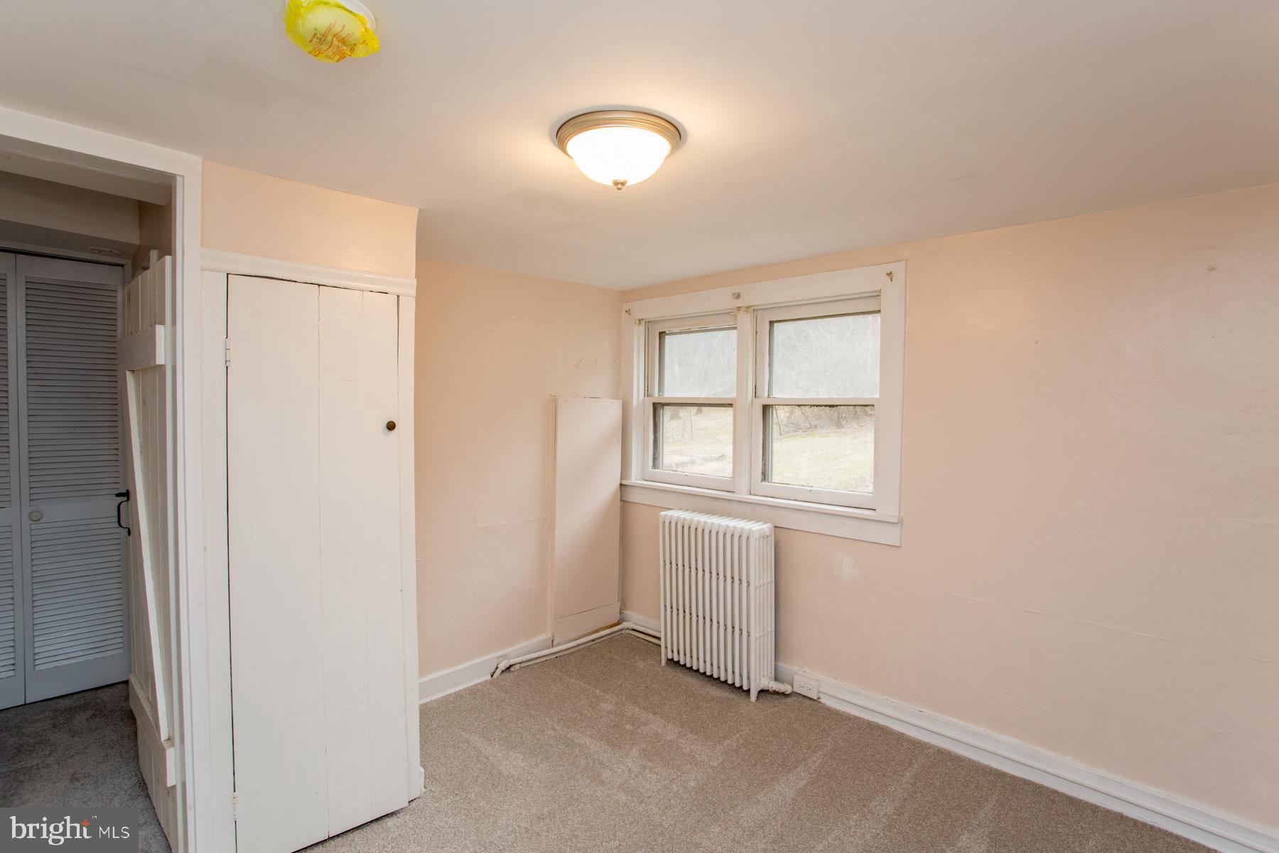 120 Tabor Road Ottsville, PA 18942 - Photo 14 of 60 an empty room with window and mirror