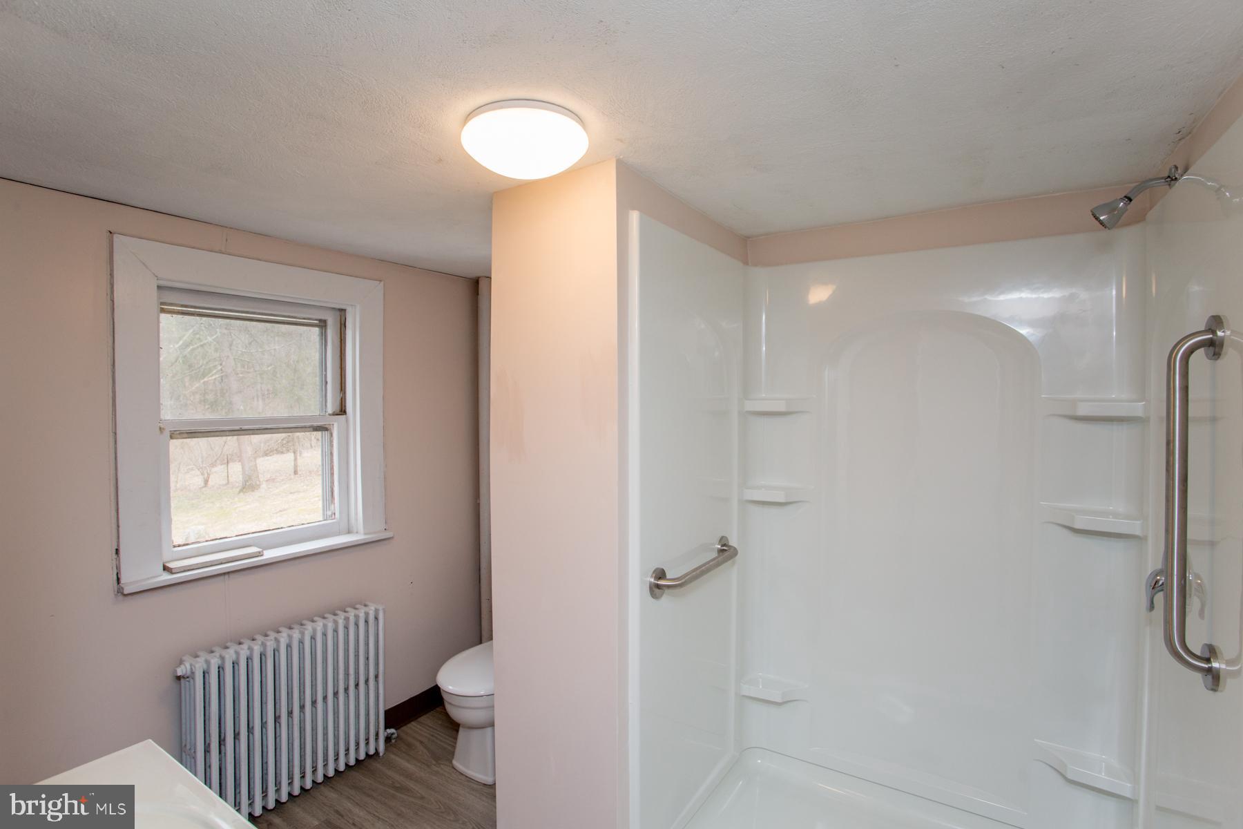 120 Tabor Road Ottsville, PA 18942 - Photo 15 of 60 a bathroom with a granite countertop shower a toilet and a sink