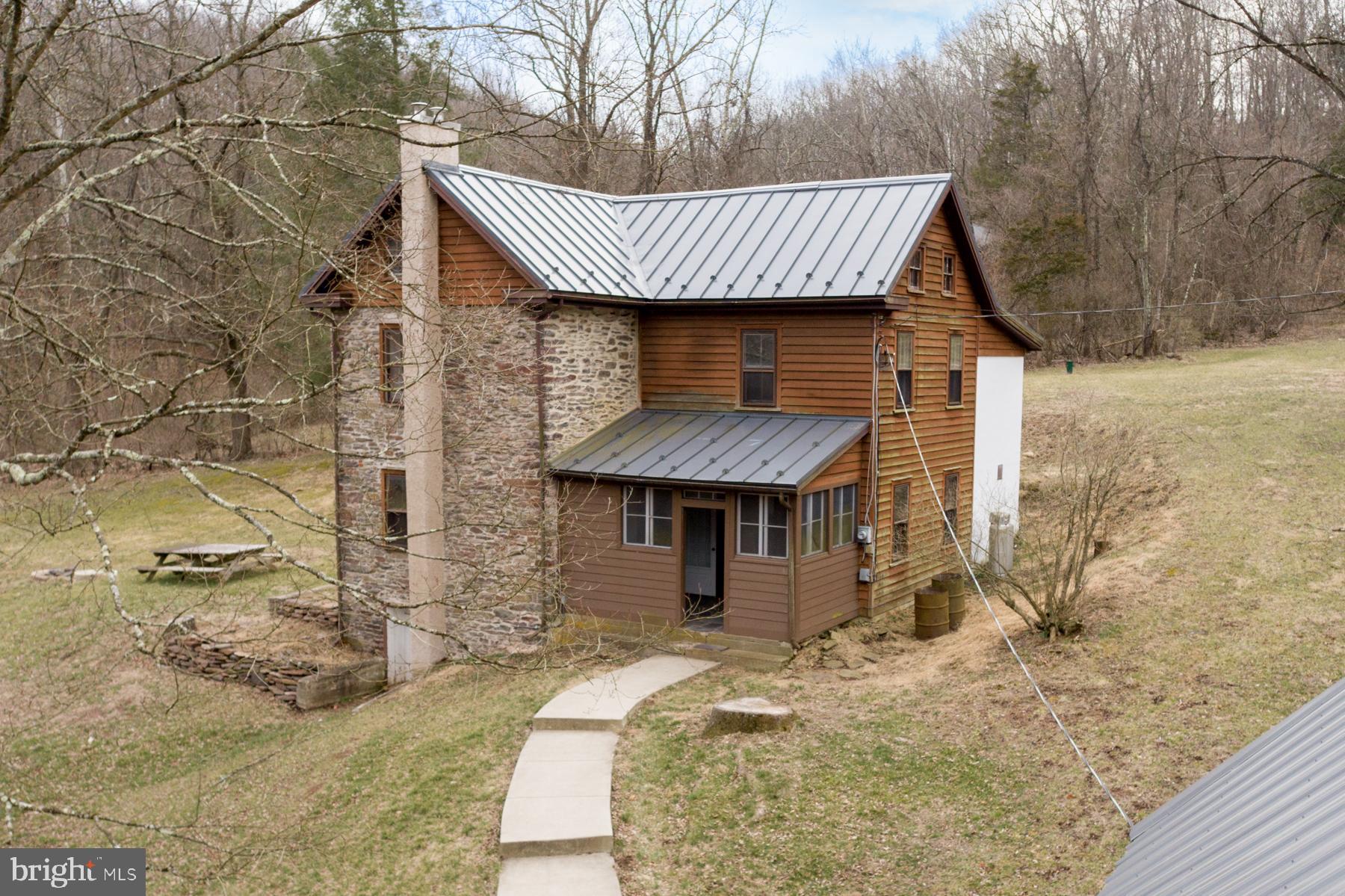 120 Tabor Road Ottsville, PA 18942 - Photo 2 of 60 a front view of a house with a garden