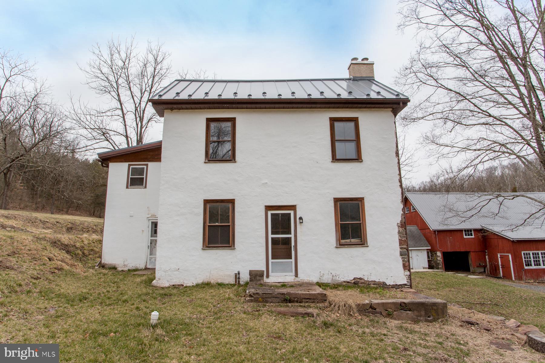 120 Tabor Road Ottsville, PA 18942 - Photo 23 of 60 a front view of a house with a garden