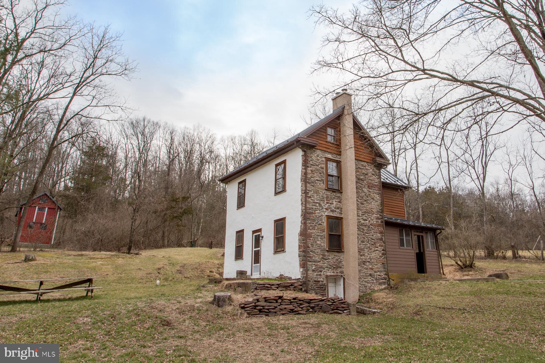 120 Tabor Road Ottsville, PA 18942 - Photo 24 of 60 a view of a house with a yard covered in snow