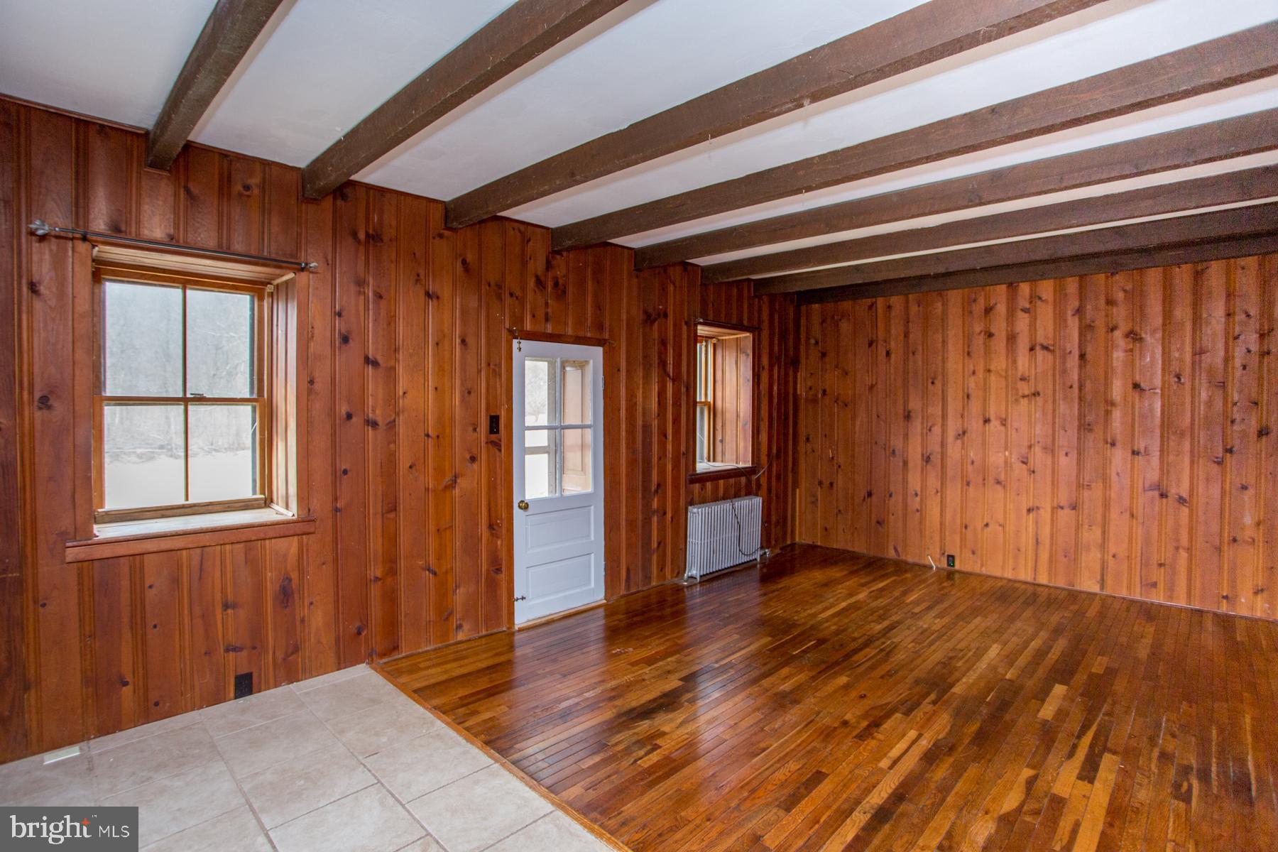 120 Tabor Road Ottsville, PA 18942 - Photo 29 of 60 a view of an empty room with wooden floor and a window