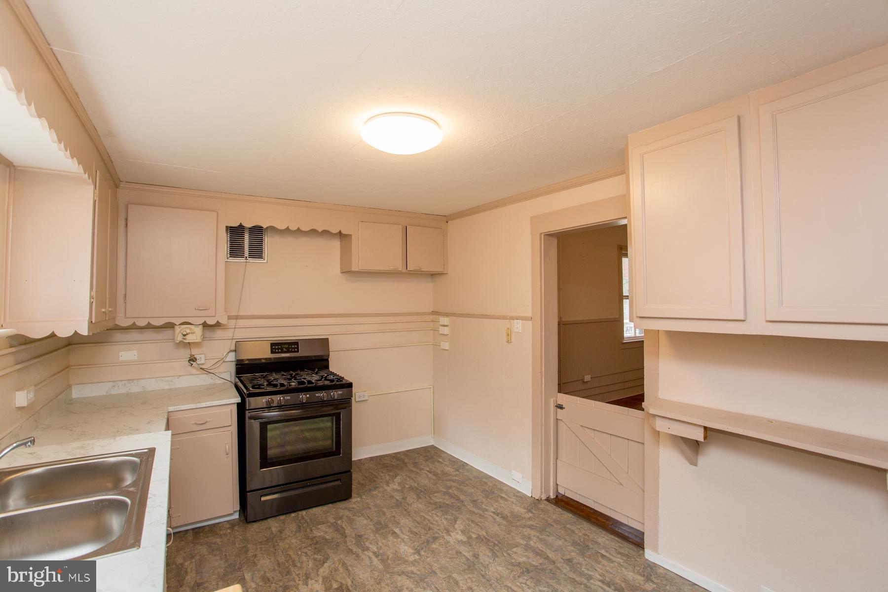 120 Tabor Road Ottsville, PA 18942 - Photo 34 of 60 a kitchen with granite countertop a stove and a refrigerator