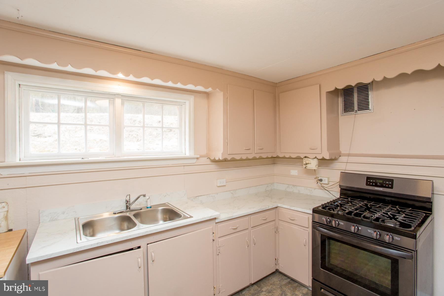 120 Tabor Road Ottsville, PA 18942 - Photo 36 of 60 a kitchen that has a sink and a stove