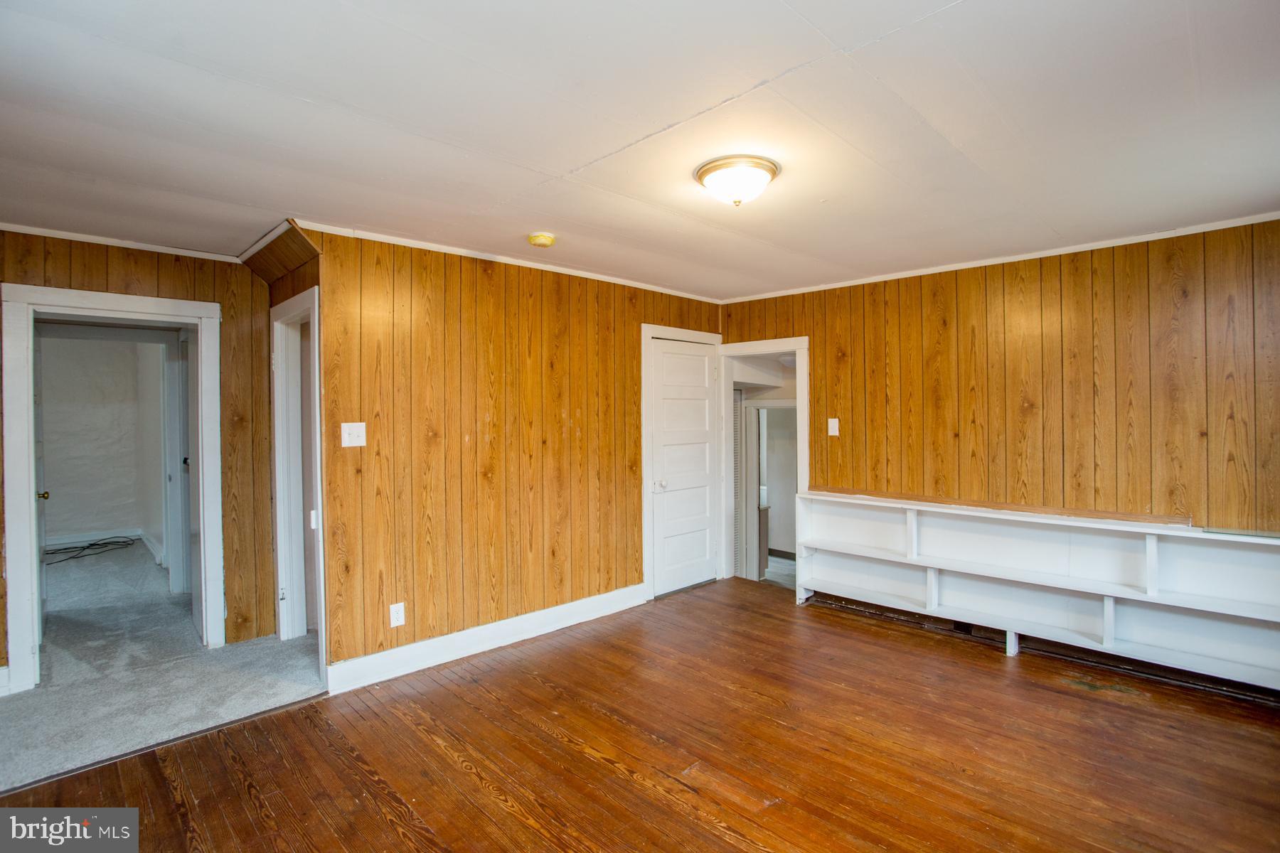 120 Tabor Road Ottsville, PA 18942 - Photo 39 of 60 a view of an empty room with wooden floor and a window