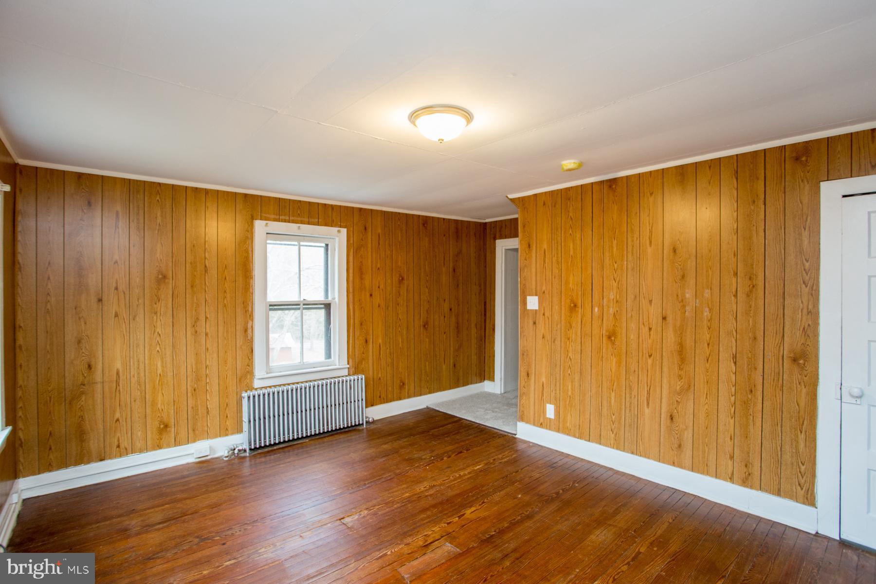 120 Tabor Road Ottsville, PA 18942 - Photo 40 of 60 a view of an empty room with wooden floor and a window