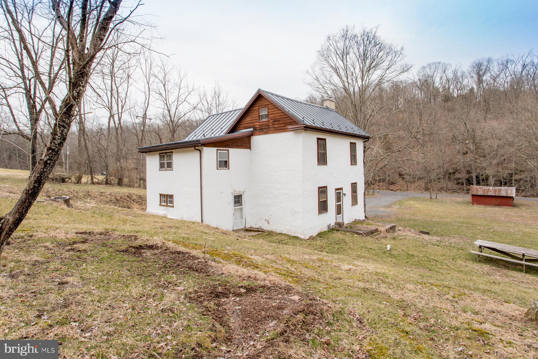 120 Tabor Road Ottsville, PA 18942 - Photo 4 of 60 a view of a house with a yard covered in snow