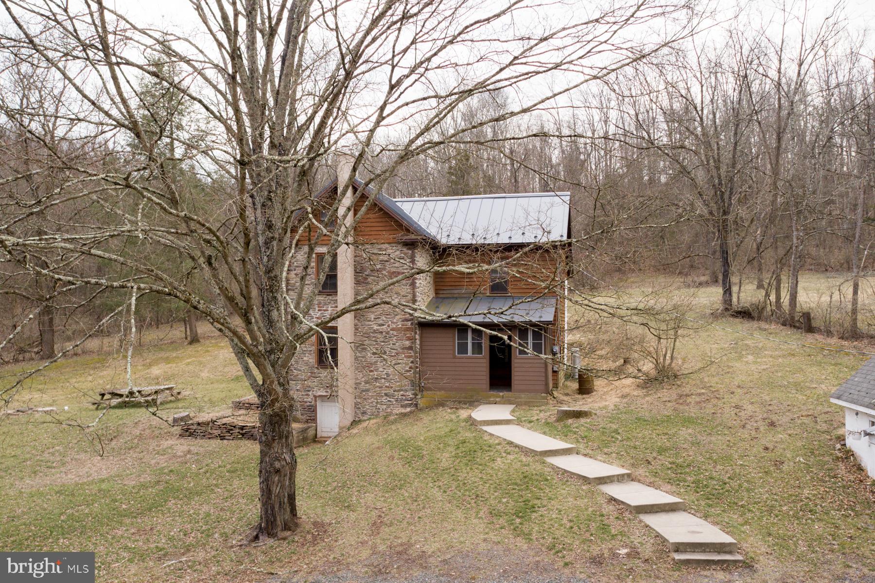 120 Tabor Road Ottsville, PA 18942 - Photo 6 of 60 a front view of a house with a yard and garage