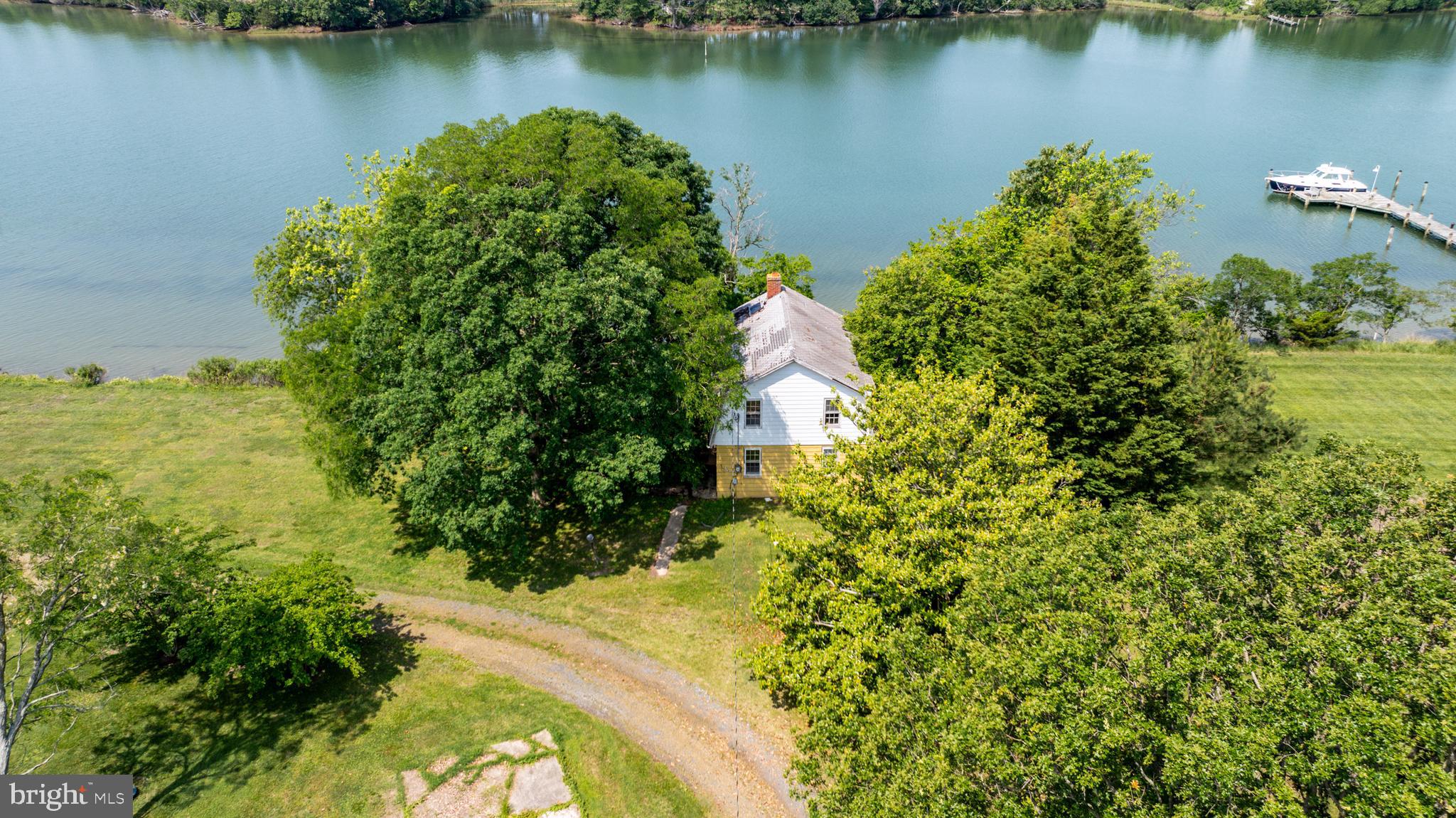 5852 Irish Creek Road Royal Oak, MD 21662 - Photo 3 of 4 an aerial view of a houses with a lake view