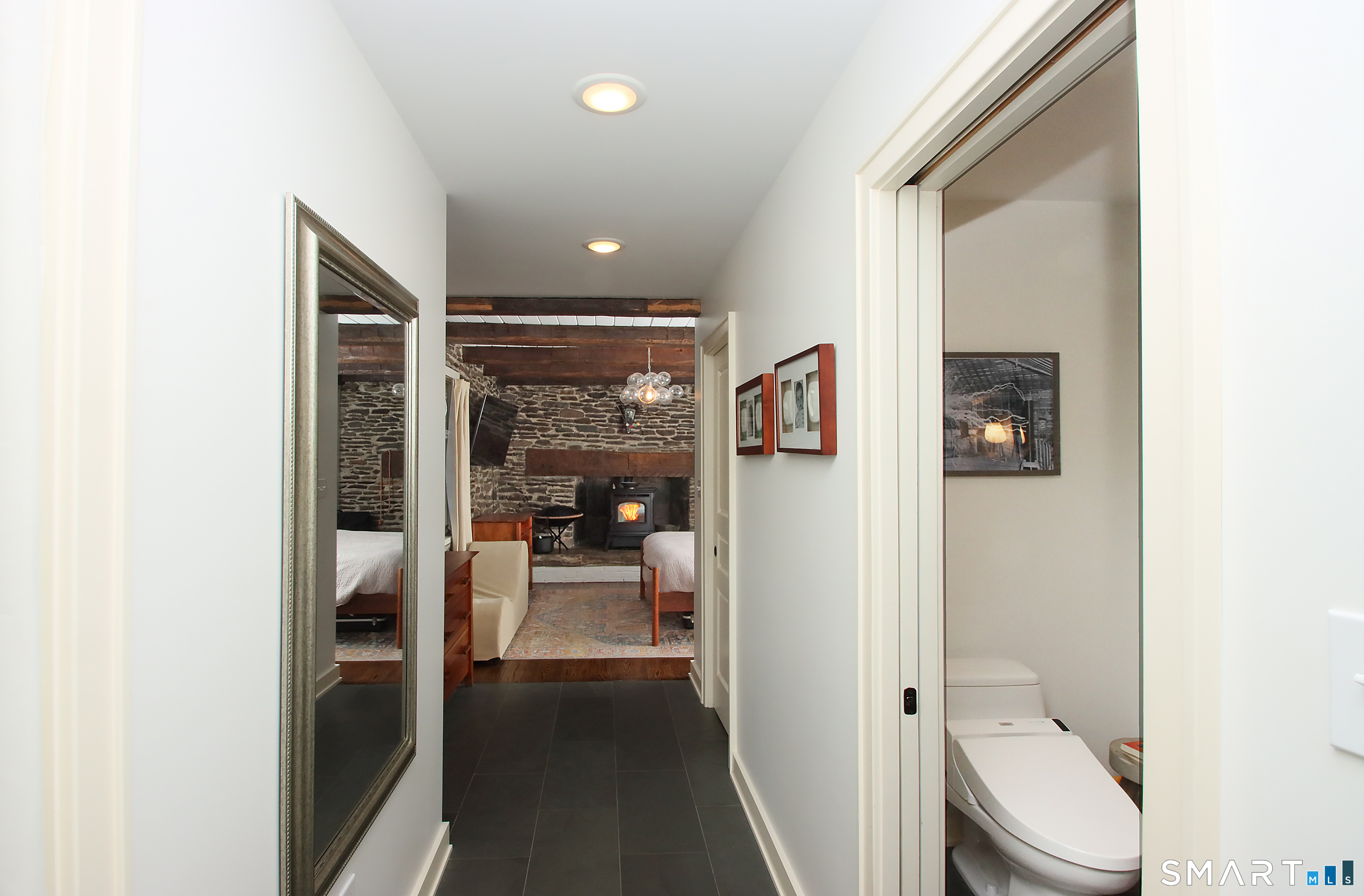 455 Barn Hill Road Monroe, CT 06468 - Photo 16 of 34 Foyer leads to half bath and Main level primary. Slate flooring