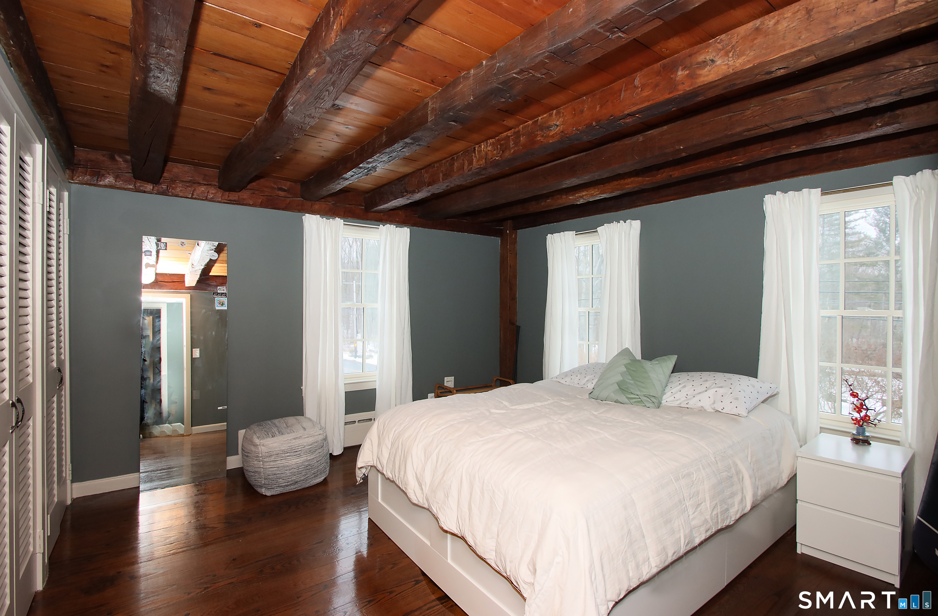 455 Barn Hill Road Monroe, CT 06468 - Photo 24 of 34 Upper bedroom with beamed ceiling and wide plank floors