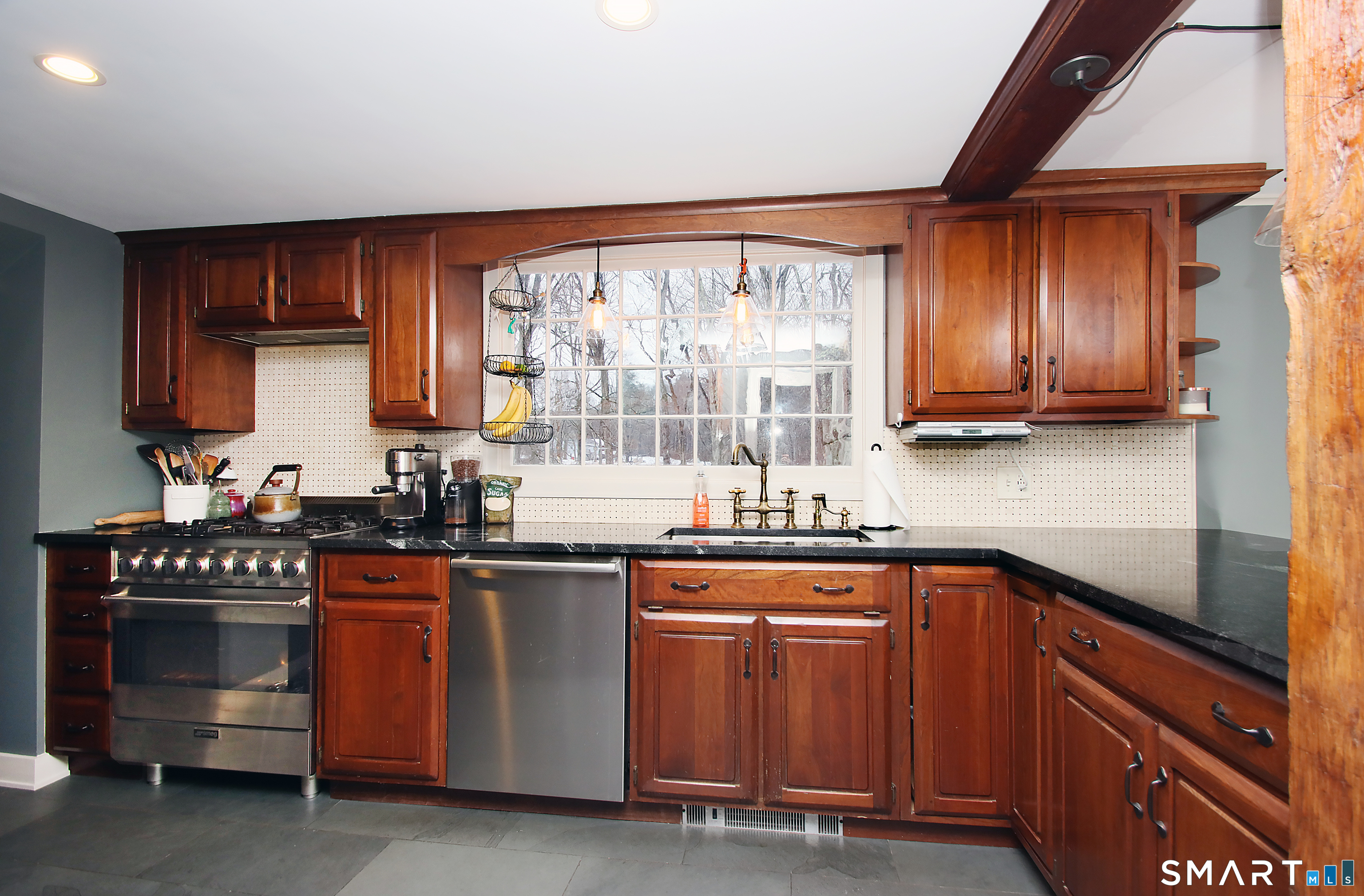 455 Barn Hill Road Monroe, CT 06468 - Photo 5 of 34 Beamed ceiling, large kitchen window overlooking lovely level rear yard