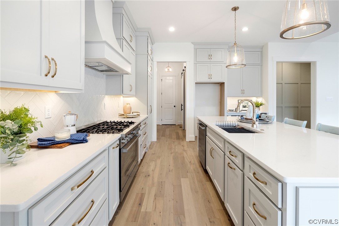 5143 Lake Summer Loop Moseley, VA 23120 - Photo 11 of 49 a kitchen with kitchen island granite countertop a sink a counter space and stainless steel appliances
