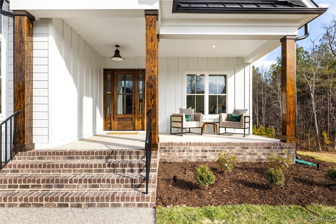 5143 Lake Summer Loop Moseley, VA 23120 - Photo 4 of 49 a front view of a house with garden